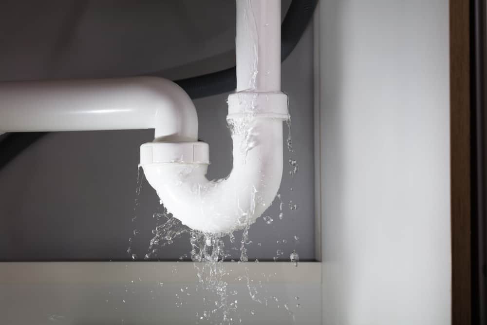 dripping pipe under kitchen sink