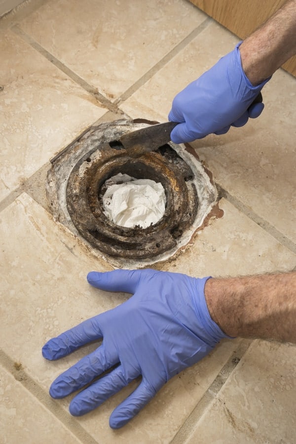 Clean Out and Examine the Toilet Flange