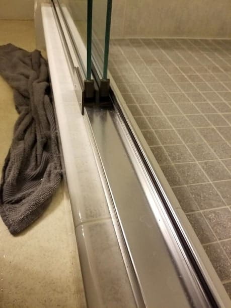 Clean shower door tracks with a steamer 1