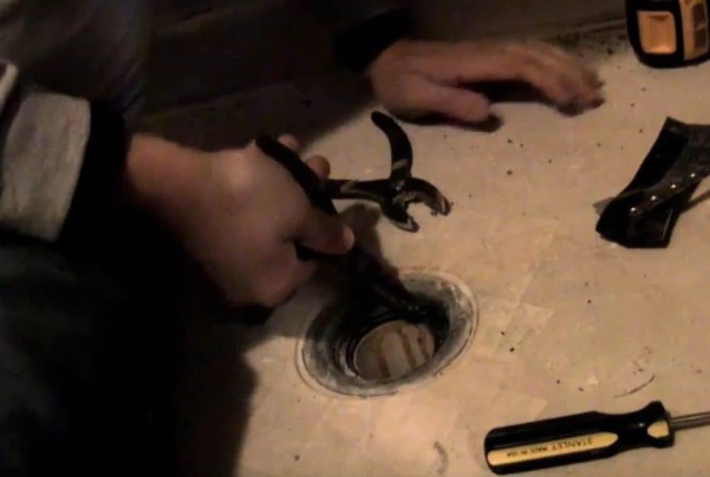 Unscrewing the rest of the drain 2