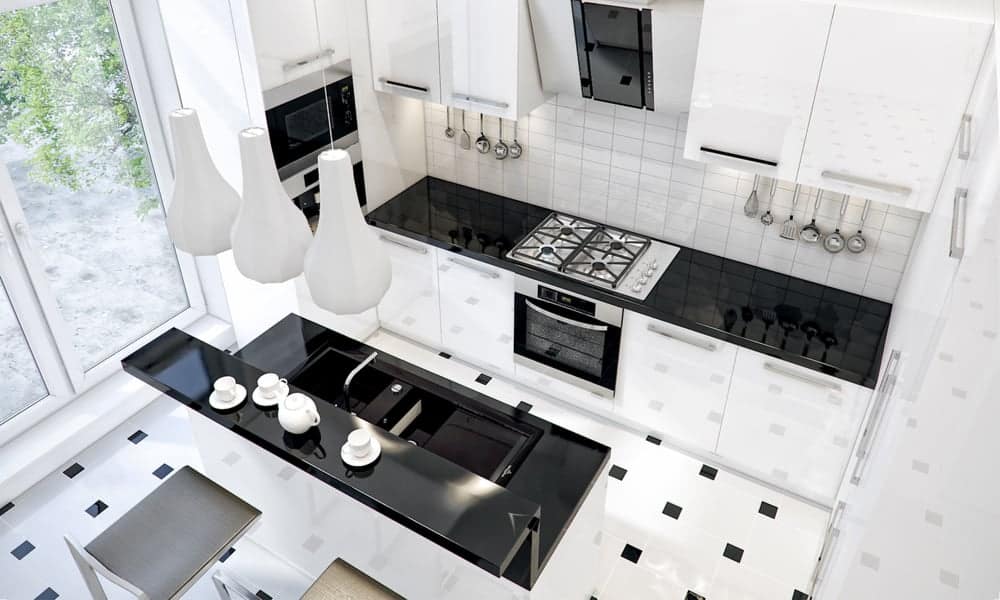 White kitchen with a glossy black countertop