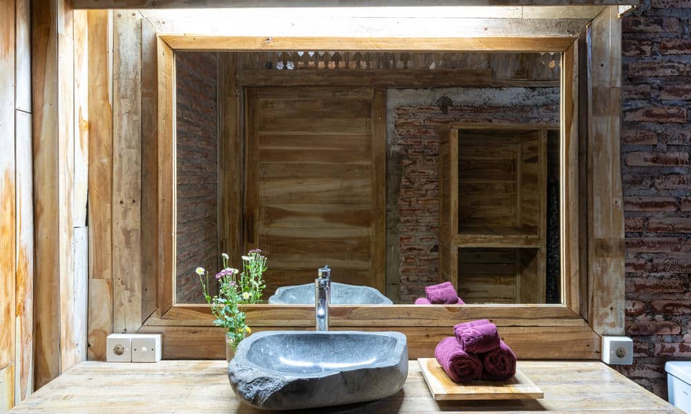 Sink Of Stone On A Wooden Table