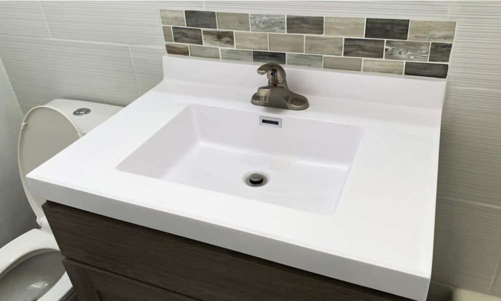 wooden backsplash behind bathroom sink