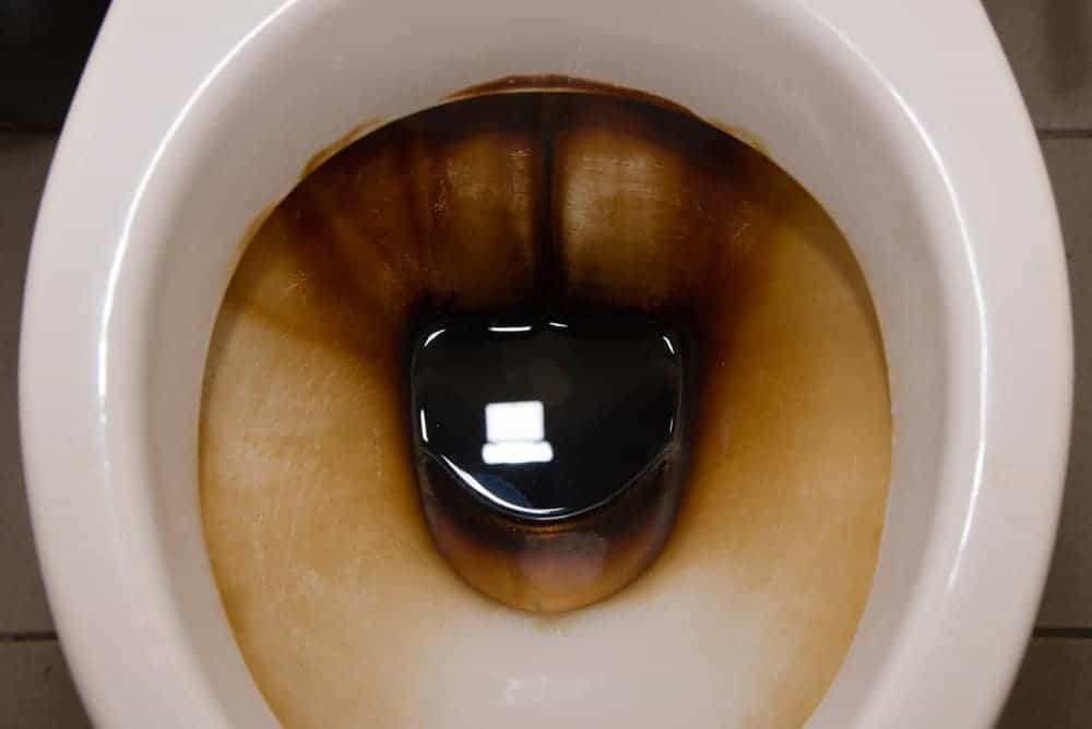 cleaning stained toilet bowl