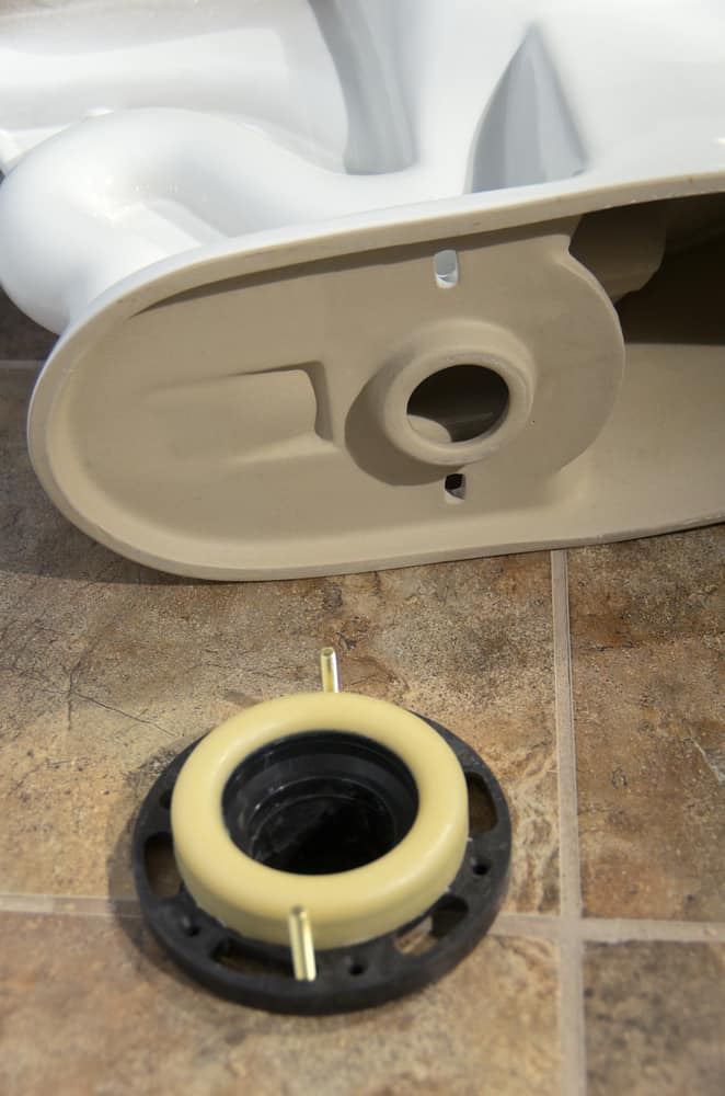 Why are toilet flanges sometimes higher or lower than the floor?